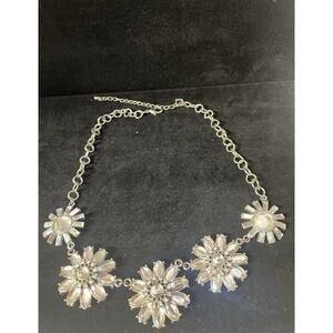 Silver-tone costume jewelry necklace featuring floral pendants with rhinestones.